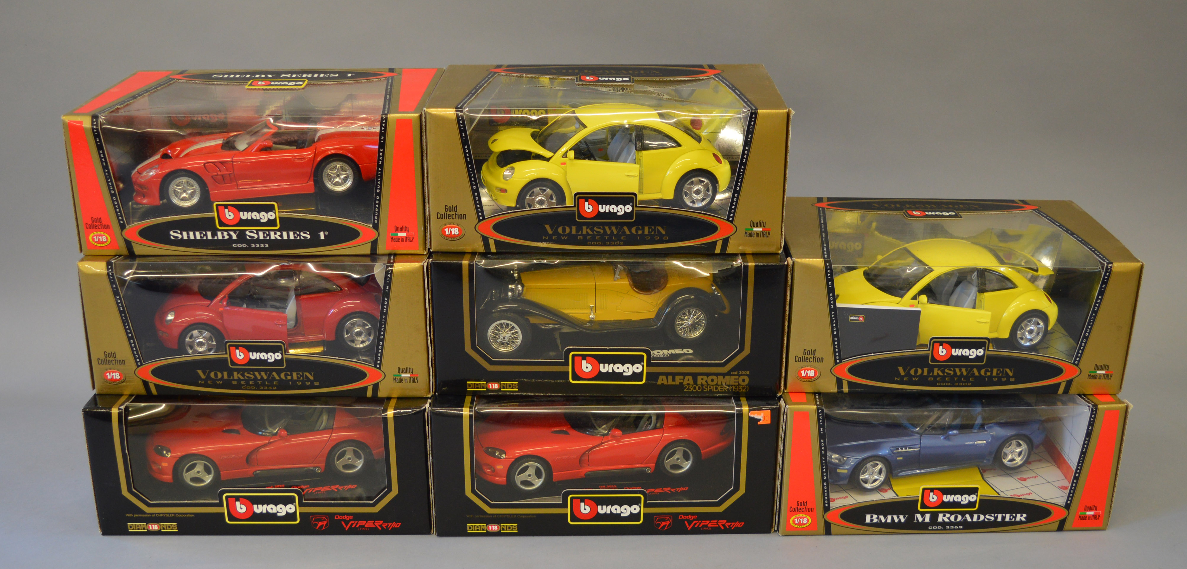 8 Boxed Bburago models including Shelby, Alfa Romeo and BMW examples.