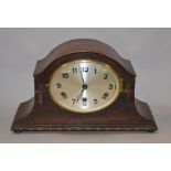 À mahogany cased chiming mantle clock with pendulum