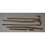 5 assorted walking sticks including silver mounted,