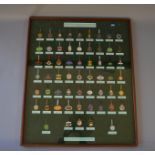 Framed and glazed set of British Racecourse Annual Members Badges (59 badges) 90cm x 74cm