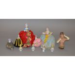 10 ceramic pin cushion ladies, some with legs.