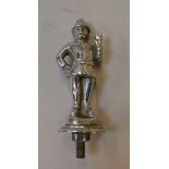 A chromed car mascot in the form of a Policeman