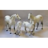 Group of 4 Beswick Dapple Grey horses (ear detached but present on one larger horses)
