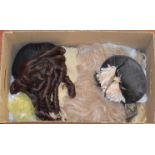 Box containing ladies wigs