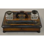 A walnut burr and ebonised inkstand with original inkwells (one missing lid) and drawer to front