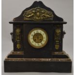 A large French Victorian marble cased ornate mantle clock.