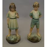 A pair of 1930s composition figures.