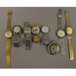 8 assorted watches including a 9ct gold rotary example, contained in a Tunbridgeware box.