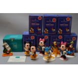 7 Royal Doulton Mickey Mouse Collection figures together with a Walt Disney Classic example,