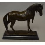 Hollow-cast bronze horse on marble base.