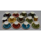 Collection of Susie Cooper coffee cans and saucers including Wedgewood examples