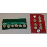 A cased set of 6 hallmarked silver buttons together with a set of 9 livery buttons