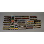 OO Gauge. 40+ assorted unboxed rolling stock. Including coaches in various liveries & goods stock.