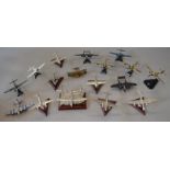 16 x pewter and diecast model aircraft on stands.
