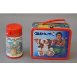 Aladdin Industries Gremlins tin lunchbox, brightly coloured and illustrated, contains flask. G.