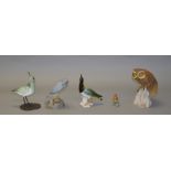 An Albany Worcester porcelain bird on metal legs and base, height 21cm,