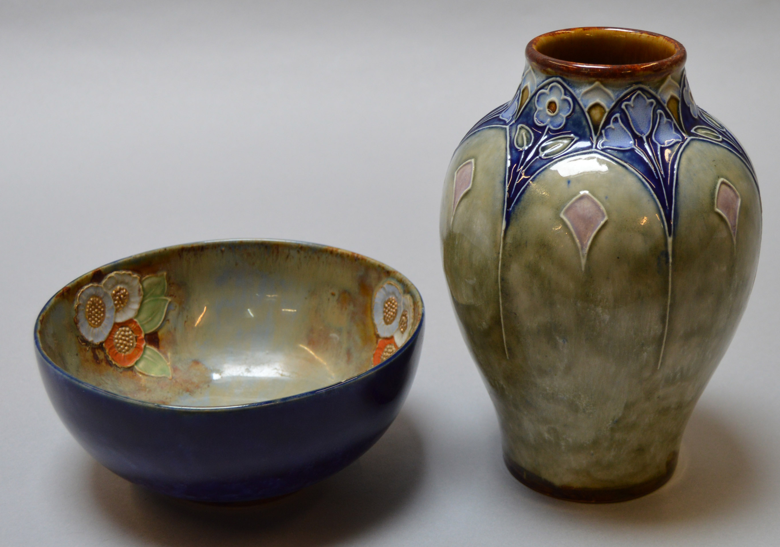 A Royal Doulton Stoneware bowl and vase impressed to base "8578 ha" and "86710 UBW" respecitvely.