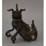 A bronze Chinese incense burner in the form of a Dragon, late 19th/early 20th century.