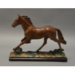 A plaster figure of a horse. Marked "OP. 512 RD. 838972" to base. Height 35cm.