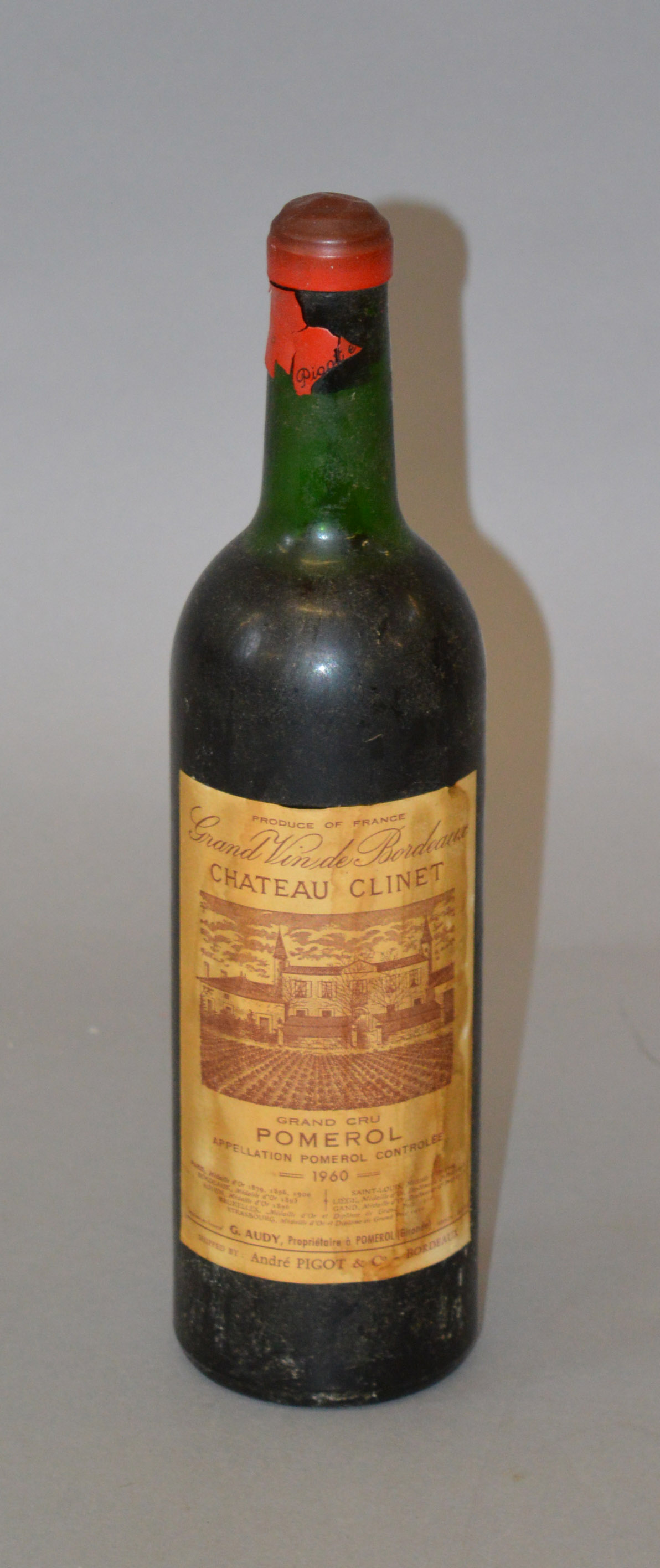 Wine: Grand Vin De Bordeaux Chateau Clinet Pomerol 1960, wax seal intact but peeling around neck.