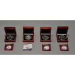 4 London Mint Office £10 5 Ounce Silver 925 comemmorative coins, contained in wooden display boxes.