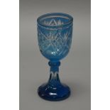 A 19th century Bohemian intaglio glass pedestal goblet. Height 20cm.