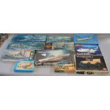 12 assorted model kits including Academy, Airfix, Heller, Revell and Hasegawa.