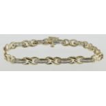 A 9ct H/M baguette diamond set panel bracelet, approx total diamond weight 1.00ct & 6.