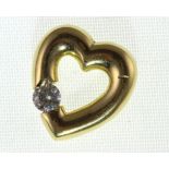 An 18ct H/M diamond set heart pendant, approx diamond weight 0.25ct, approx 3.