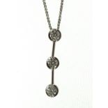 An 18ct H/M three stone diamond drop pendant & chain, approx total diamond weight 0.