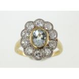 A aquamarine & diamond oval cluster ring, approx total diamond weight 1.