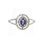 An 18ct H/M white gold sapphire and diamond cluster ring, approx 3.