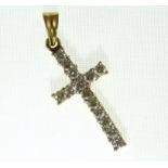 An 18ct H/M diamond set cross, approx total diamond weight 0.75ct, approx 2.