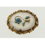 A Victorian chalcedony & turqouise set brooch, unmarked gold frame with engraved decoration,