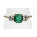 An Emerald and Diamond three-stone ring stamped 18ct, approx total Diamond weight 0.