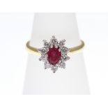 A Ruby and Diamond cluster ring, 18ct H/M, approx Diamond weight 0.50ct, approx Ruby weight 0.