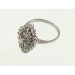 A 1960's 18ct white gold diamond cluster ring, approx 0.50ct & 3.