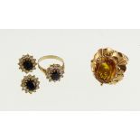 A large citrine set ring marked '18' together with a stone set cluster ring & ear ring set,