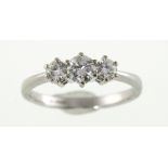 A 9ct white gold three-stone diamond ring, approx total weight 0.75ct & 2.