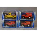 Four boxed Universal Hobbies Land Rover Defender models in 1:18 scale,