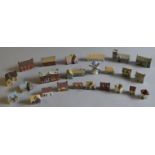 25 Wade miniature buildings together with 8 boxed Wade Whimsies, 7 Lilliput Lane models.