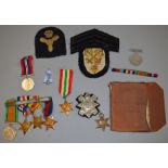 Collection of various medals and similar including a WW2 Army pay book, cap badges, ribbon bars etc.