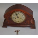 Vintage chiming mantle clock with inlaid venner case, tin face (s/d) with key and pendulum.