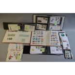 Quantity of assorted stamps and FDCs contained in 8 albums.