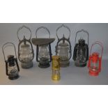 7 ssorted lanterns including a German Feurhand, Veritas Pax and others.