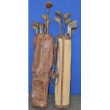 23 assorted vintage golf clubs. Contained in two vintage bags.