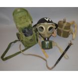 A WW2 Wardens helmet marked "W" together with a WW1 water canteen and 2 gas masks (4)