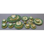 A part-complete set of Clarice Cliff Aura (Green) dinner service, pattern 6385.