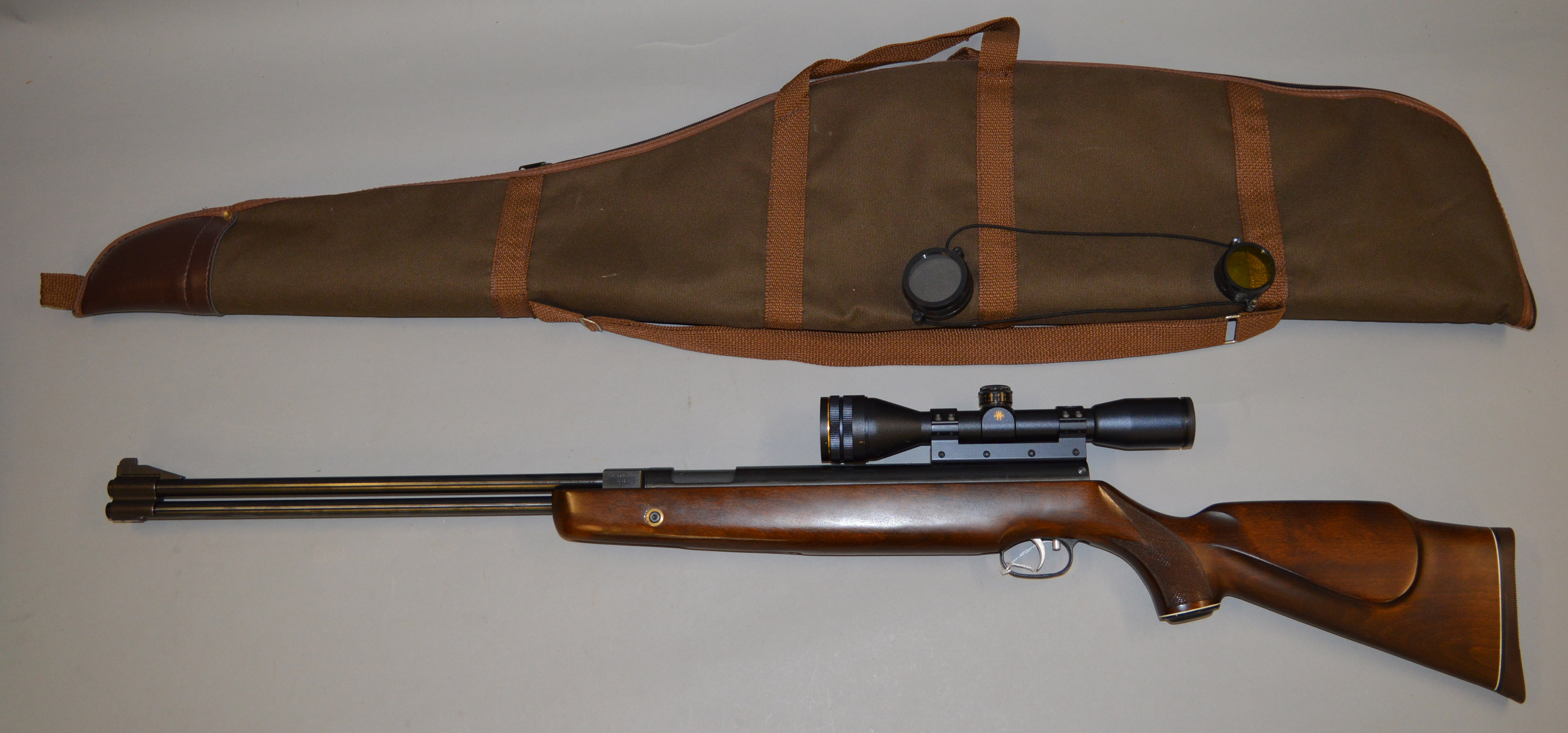A Weihrauch HW77 .22 air rifle with HW440MA sight and sun guard and soft case.