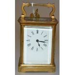 A vintage brass cased carriage timepiece,